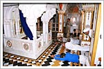 Devotees perform prostrations to the shrine