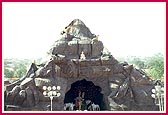 A cave mandir with murtis of Lord Krishna and Radha