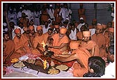 Swamishri lights the yagna kund with the fire 