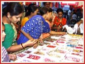 Sisters enthusiastically shop, purchasing rakhadis that range from a few Rupees to more than Rs. 5000