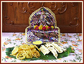 The Lord being offered  jalebi and fafda with chutney