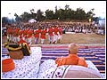 Tribal villagers dancing before Swamishri