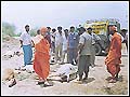 Sadhus inspecting cyclone-affected area