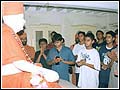 The balaks praying for Swamishri's health at his birthplace in Chansad