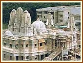 A view of the  Mandir and the Haveli in the background .