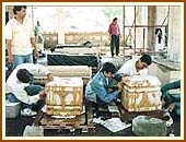 Youth volunteers  meticulously polishing the stones 