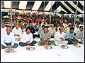 Devotees participate in the mahapuja during the inauguration ceremony