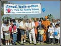 Attorneys Frank and Simone cut the ribbon to start the walk