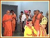 Swamishri is led out from his room by young balaks