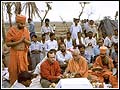 Sadhus conduct the traditional Vedic ground-breaking ceremony