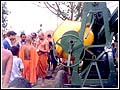 Sadhus perform pujan of some of the equipment to be used in the reconstruction process