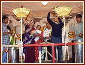 Devotees performing Maha-Abhishek by pouring holy water brought from 108 rivers 