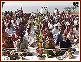 Devotees participate in the Maha Abhishek Ceremony on the Mandir podium