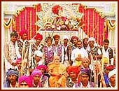 Tribal youths pose for a photograph with Swamishri 