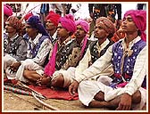 Adivasis (tribals) in traditional garb, with their hand-made bows and arrows