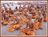 Performing rites for Bhagwat diksha, after changing from white clothes to saffron