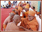 The senior sadhus give a new kanthi, gatariyu (upper garment) and pagh (turban)  to the newly initiated sadhus