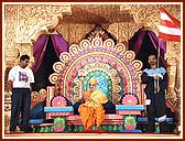 Swamishri holding a torch, carried by a team of 11 satsangi youths (Gondal) in an all India crusade against Aids and addictions