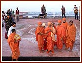 Swamishri in devotional mood on the portico of the new Mandir