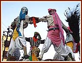 Exciting human pyramids during the procession by youth dancers, sadhus and tribal youths