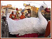 On the streets of Valsad the murtis of Shri Akshar Purushottam Maharaj, Shri Harikrishna Maharaj and Shri Ghanshyam Maharaj are paraded in a Peacock float, Swan float and Fish float respectively