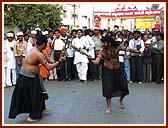 A mock fight between fake black magic practitioners 