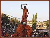 Exciting human pyramids during the procession by youth dancers, sadhus and tribal youths