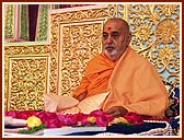 Performing tilak chandlo and chanting the name of Swaminarayan during his morning puja