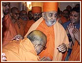 Blessing sadhus while on the way to his morning puja