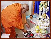 Performing Vedic worship (pujan) of Shivling, Shri Shiv-Parvati and Ganpatiji