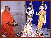 Performing Vedic worship (pujan) of Shivling, Shri Shiv-Parvati and Ganpatiji