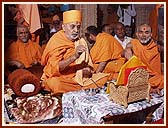 Swamishri engrossed in the Pujan of Shri Harikrishna Maharaj (Thakorji)