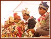 73 grooms after receiving the blessings of Swamishri during the mass marriage arranged by the Sanstha