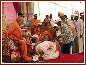 73 grooms after receiving the blessings of Swamishri during the mass marriage arranged by the Sanstha