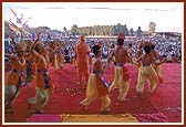 With Swamishri in center, children dance to the tune of 'Swami aviya re aviya...' during the Joli festival assembly