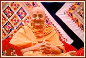 Swamishri singing the glory of Bhagatji Maharaj during the Birthday Celebration assembly 