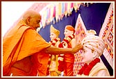 Swamishri singing the glory of Bhagatji Maharaj during the Birthday Celebration assembly 