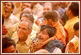 Flushed in a spray of colored water, the devotees ecstatically relish the ultimate moments of the festival