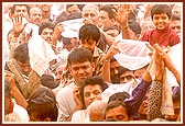 Flushed in a spray of colored water, the devotees ecstatically relish the ultimate moments of the festival