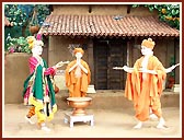 A colorful rustic stage depicting the celebration of Pushpadolotsav by Lord Swaminarayan with the paramhansas in the darbar of Rathod Dhadhal in Sarangpur     