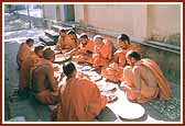 Sadhus preparing a meal to offer to the Lord