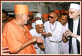  With devotees who were witness to Swamishri's appointment as president