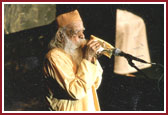 Swami Bua, a saint over 100 years old, blowing a conch as the opening invocation at the World Peace Summit
