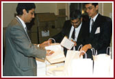 BAPS volunteers registering the delegates at the Astoria Hotel and making arrangements for their accomodation and transport for the 4-day Summit