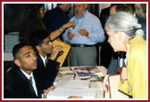 BAPS volunteers registering the delegates at the Astoria Hotel and making arrangements for their accomodation and transport for the 4-day Summit