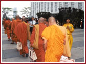 A delegation of Buddhist monks being welcomed by a traditional Peacock Dance by BAPS children