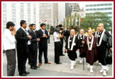 The Most Reverend Kuni Kuniaki of the Shinto faith, Japan, is welcomed with his disciples