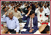 Devotees participating in the mahapooja ceremony