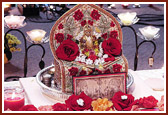 Harikrishna MaLord Harikrishna Maharaj adorned with divas and flowers