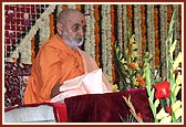 Saying the rosary during his puja